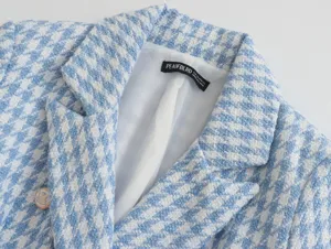 Blue and white houndstooth blazer detail, featuring classic lapel and premium tweed fabric texture.