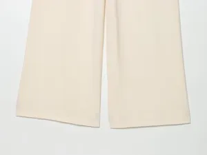 Womens wide leg trousers hem detail, lightweight smooth summer fabric close-up view.