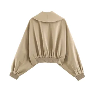 Back view detail of stylish khaki cropped jacket featuring large lapel and lantern sleeves.