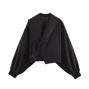 Black cropped jacket detail, featuring an oversized shawl collar and elegant lantern sleeves.