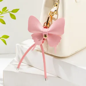 DIY colgante de bolso con lazo de cuero rosa hecho a mano accesorio corto de moda para mujer