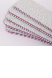 Professional nail file detail view, dual abrasive surface, essential manicure tool.