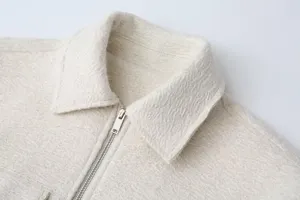 Beige textured wool lapel jacket detail shot, stylish and warm autumn winter outerwear piece.