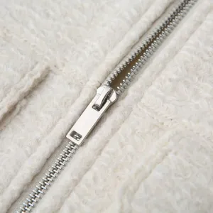 Off-white sherpa fleece jacket zipper detail, soft texture cozy outerwear essential