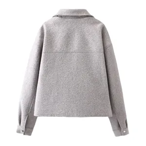Detailed back view of grey textured wool blend jacket showing lapel collar and button cuffs.