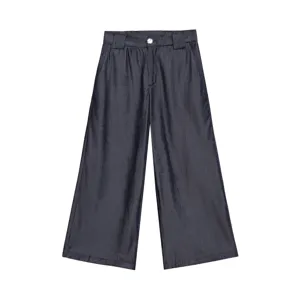 Detailed view of dark wide leg trousers featuring a high waist design and metal button closure.