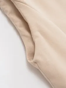 Close-up detail of women's stylish summer vest trousers suit pocket and fine stitching.