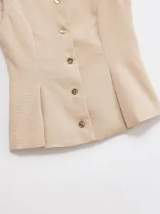 Beige sleeveless vest detail showing front metallic gold buttons, stylish commuting apparel.