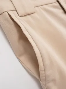 Beige casual women pants pocket detail closeup showcasing fine fabric and clean design.