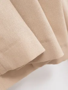 Beige fabric texture close-up detail shot for women's summer clothing apparel design.