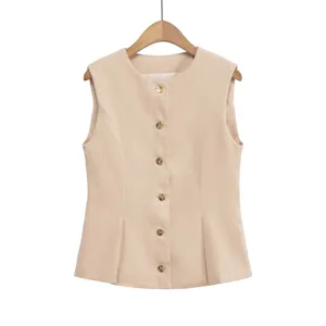 Beige sleeveless button-down vest detail shot, elegant slim fit minimalist commuting top.