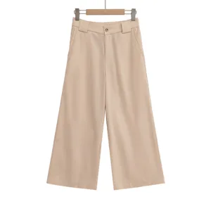 Khaki wide leg pants detail view, high waisted trousers on wooden hanger, summer wear.