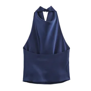 Close-up detail of elegant dark blue satin cowl neck halter top, smooth fabric texture.