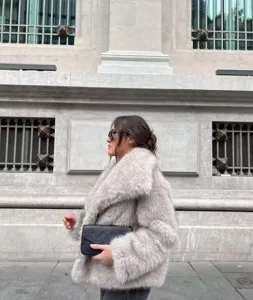 Stylish short faux fur coat for women, warm winter fluffy outerwear with lapel collar.