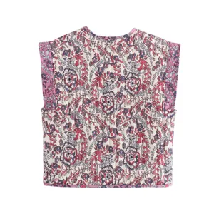 Close-up detail of the retro ethnic floral quilted vest, showing fine stitching pattern.