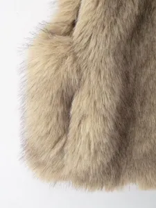 Detailed view of women faux fur vest, soft plush winter sleeveless outerwear, warm shaggy fashion.