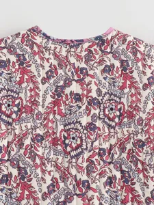 Close-up of women vintage floral quilted vest back detail, elegant pattern design.