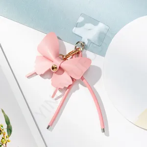 Correa de teléfono de cuero rosa chic lazo colgante anti-pérdida accesorio detalle
