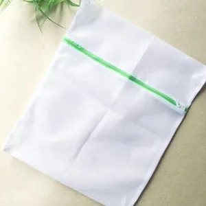 White mesh laundry bag with green zipper, durable washing machine protective net for clothes.