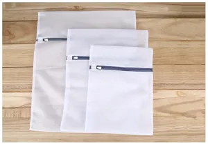 Detailed view of white mesh laundry bags set, thick fine mesh washing bags with zippers.