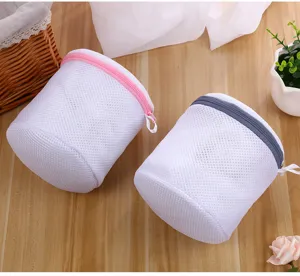 Cylindrical mesh laundry bag with secure zipper for washing bras and underwear safely daily.