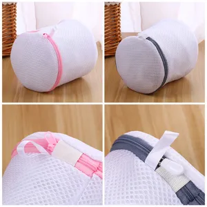 Close-up detail view of cylindrical mesh laundry bra wash bag with zipper and protective strap.
