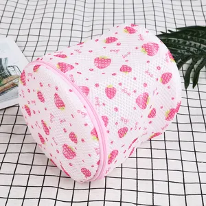 Pink strawberry print cylindrical mesh laundry bag for bra and underwear protection.