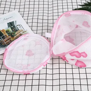 Mesh laundry bag with pink zipper and heart pattern for delicate underwear and bras wash.