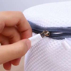 Detailed view of white sandwich mesh laundry wash bag with zipper for bra and underwear protection.