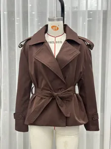 Classic brown trench coat for women with lapel collar and waist belt, short design.