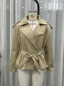 Beige short trench coat detail, lapel collar, double-breasted design with fabric belt.