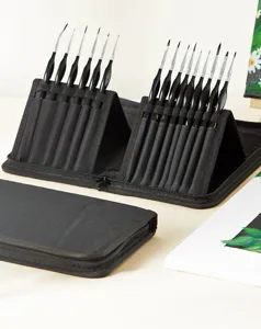 Detail shot of 15-piece fine detail paintbrush set with black canvas case for precision art.