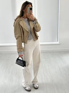 Cropped double-breasted trench jacket for women, casual stylish outerwear in autumn fashion.