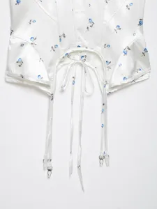 Floral satin corset camisole with garter clips, featuring boning details and straps.