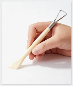 Clay sculpting tool detail view, double-ended pottery carving accessory for DIY art crafting.