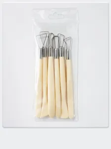 Detailed view of the 6-piece polymer clay sculpting tool set with metal tips and beige handles.