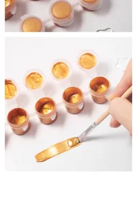 Gedetailleerd overzicht van gouden acrylverfpotjes met 6 rasters en penseel voor knutselen.