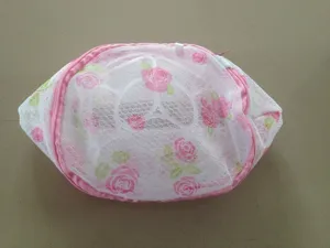 Fine mesh printed laundry bag detail showing delicate floral pattern and durable zipper edge design.