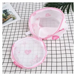 Pink cylindrical thickened sandwich mesh laundry bag for underwear and bras, durable design.