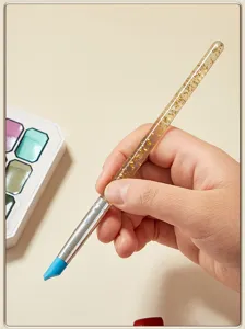 Silicone painting brush detail view, clear gold glitter handle for watercolor and nail art shaping.