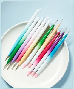 Close up of colorful double ended nail art silicone brushes and metal dotting pens set.