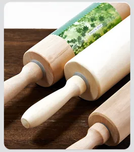 Wooden rolling pin detail shot, natural wood texture with smooth bearing handle for clay and dough.