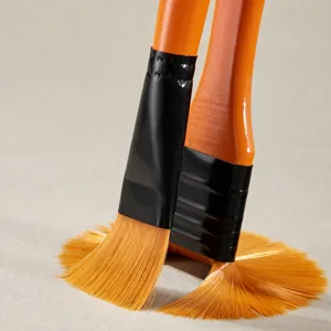 Professional nylon paintbrush set with orange handles, ideal for watercolor and acrylic painting.