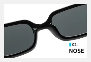 Gros plan sur le pont nasal des lunettes de soleil carrées étroites, monture noire élégante.