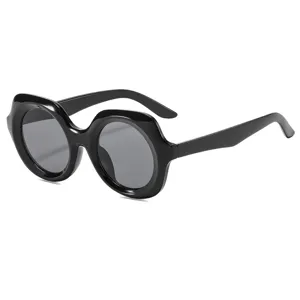 Chunky round frame sunglasses, black casual UV protection sun glasses for street style photo shoot.