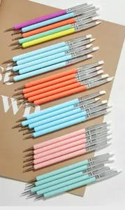 Silicone nail art brush detail view showing dual-ended sculpting pens and dotting tools.