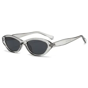 Trendy narrow cat eye sunglasses with translucent grey frame and black lenses for women.