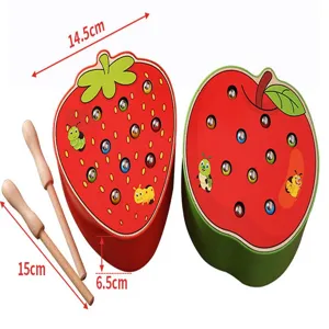 Wooden Montessori fruit bug catching toy, detailed view of strawberry and apple shape.