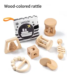 Wooden baby rattle and sensory cloth book set details showing natural beech wood finish.
