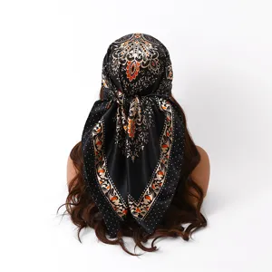 Detailed rear view of a black satin silk square scarf with vintage floral and polka dot print.